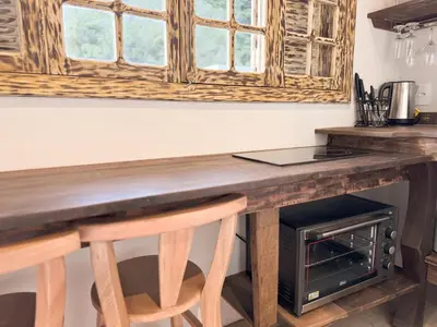 A cozinha ou kitchenette de Cabana Com Hidro Na Natureza - Baoba Suites