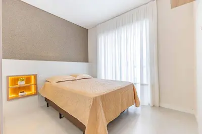 Uma cama ou camas num quarto em Ampla Cobertura Duplex com Jacuzzi Privativa