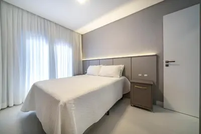 Uma cama ou camas num quarto em Sunrise Residence - Apto 2 dormitórios Praia de Bombinhas - Centro