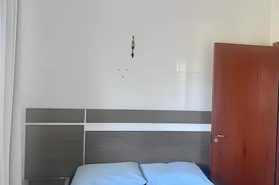 Uma cama ou camas num quarto em Perfeito! Apto 1 quarto na Praia de Palmas - WG04I