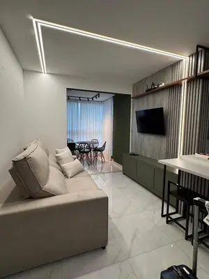 Uma televisão e/ou sistema de entretenimento em Gran Safira Residential Apartment