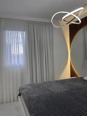 Uma cama ou camas num quarto em Gran Safira Residential Apartment