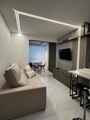 Uma televisão e/ou sistema de entretenimento em Gran Safira Residential Apartment