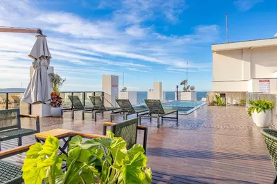 Uma varanda ou terraço em Elegância e Conforto em Suíte a 120 metros da praia de Bombinhas
