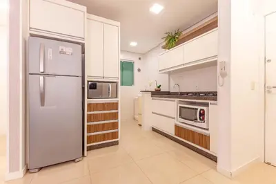 A cozinha ou kitchenette de Confortável Apto a 70 Metros da Praia de Bombinhas