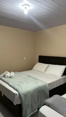 Uma cama ou camas num quarto em Pousada da Luz 20v