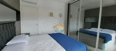 Uma cama ou camas num quarto em Cobertura Alto Padrão no Centro de Bombinhas com 03 Suítes