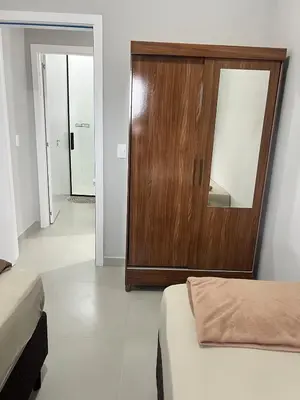 Uma cama ou camas num quarto em Casa em Tijucas da tati