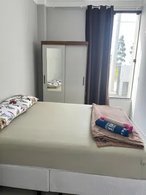 Uma cama ou camas num quarto em Casa em Tijucas da tati