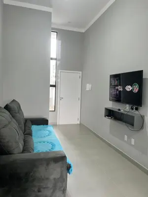 Uma televisão e/ou sistema de entretenimento em Casa em Tijucas da taty