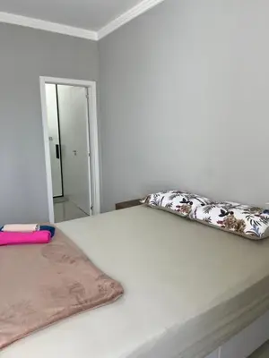 Uma cama ou camas num quarto em Casa em Tijucas da taty