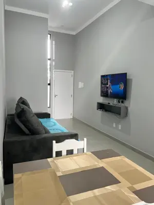Uma televisão e/ou sistema de entretenimento em Casa em Tijucas da taty