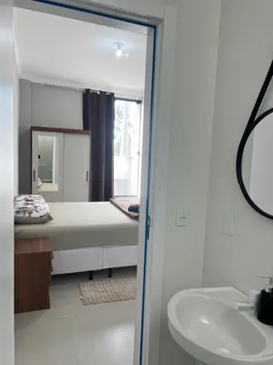 Uma cama ou camas num quarto em Casa em Tijucas da taty