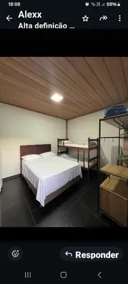 Uma cama ou camas num quarto em Suíte Varandas