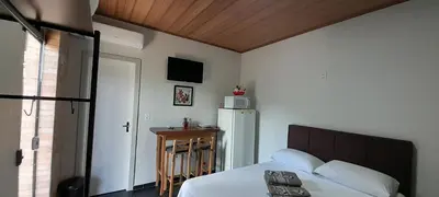 Uma cama ou camas num quarto em Suíte Varandas
