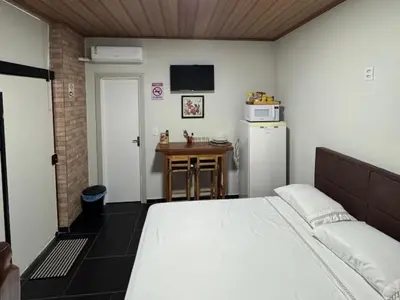 Uma cama ou camas num quarto em Suíte Varandas