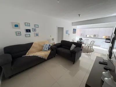 Uma área de estar em Apartamento Quadra Mar