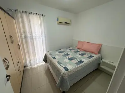 Uma cama ou camas num quarto em Apartamento Quadra Mar