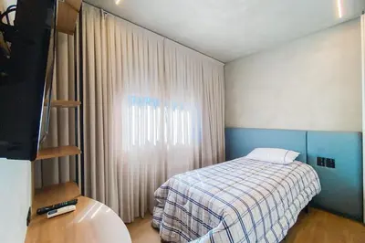 Uma cama ou camas num quarto em Praia de Palmas Cobertura Alto Padrão 200m do Mar - 0199