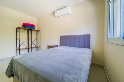 Uma cama ou camas num quarto em Praia de Palmas, 500m, Conforto e Praticidade, 0178