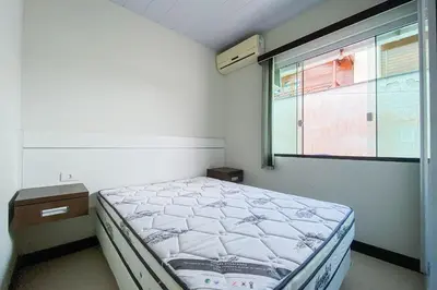 Uma cama ou camas num quarto em Casa 400m da Praia de Palmas - 0343