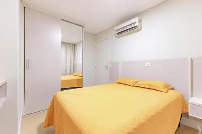 Uma cama ou camas num quarto em Boulevard: Apto Exclusivo a Passos do Mar