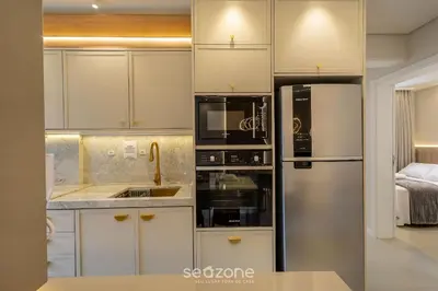 A cozinha ou kitchenette de Apt c/ Churrasq. 600m da Praia AQT0604