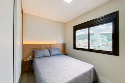 Uma cama ou camas num quarto em Praia de Palmas - Vista Mar - Torre B - Novo - 0484