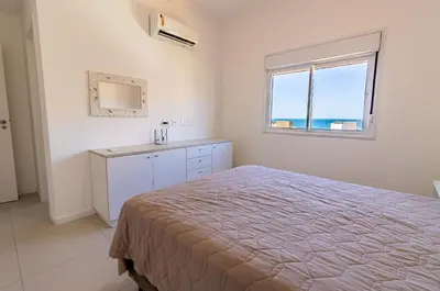 Uma cama ou camas num quarto em 1064- Excelente apto na praia de Bombinhas