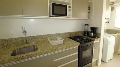 A cozinha ou kitchenette de 1064- Excelente apto na praia de Bombinhas