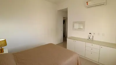 Uma cama ou camas num quarto em 1064- Excelente apto na praia de Bombinhas