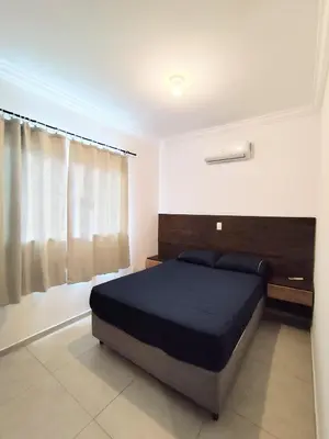 Uma cama ou camas num quarto em Residencial Ernesto Neves - 5 min da praia de Bombas