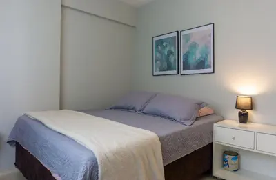 Uma cama ou camas num quarto em Pé na Areia c/ Churrasqueira | 3 Quartos + Vaga