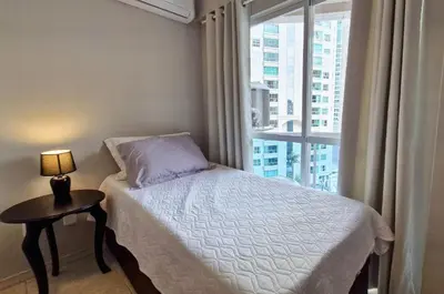 Uma cama ou camas num quarto em Pé na Areia c/ Churrasqueira | 3 Quartos + Vaga