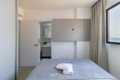 Uma cama ou camas num quarto em Apto Novo a 150m da Praia de Pereque CLE1202