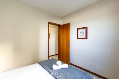 Uma cama ou camas num quarto em Apto Beira-Mar c/ Vista p/ Praia VTE0301