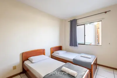 Uma cama ou camas num quarto em Apto Beira-Mar c/ Vista p/ Praia VTE0301