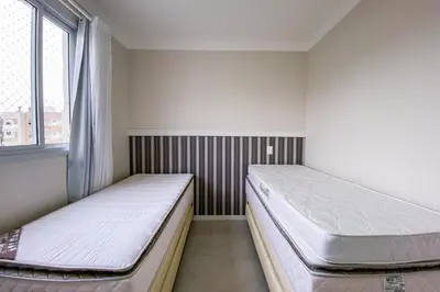 Uma cama ou camas num quarto em Praia de Palmas - Apto 500m da Praia, 2 Dorms - 0180