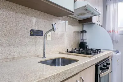 A cozinha ou kitchenette de Praia de Palmas - Aconchego a 500m do Mar 0181