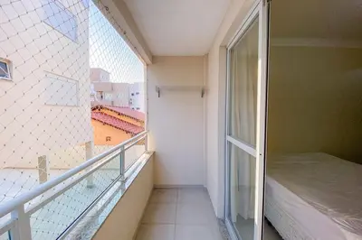 Uma varanda ou terraço em Praia de Palmas - Aconchego a 500m do Mar 0181