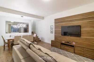 Uma televisão e/ou sistema de entretenimento em Casa c/ 3 Quartos e Churrasqueira PMC0400