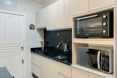 A cozinha ou kitchenette de Praia de Palmas, casa com espaço externo - 0489
