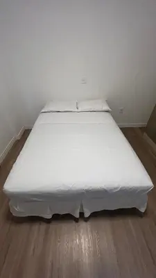 Uma cama ou camas num quarto em Apartamento à 100 metros do mar - Meia Praia