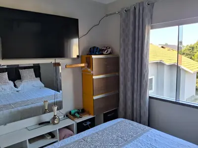 Uma cama ou camas num quarto em Quarto em Tijucas