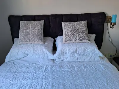 Uma cama ou camas num quarto em Quarto em Tijucas