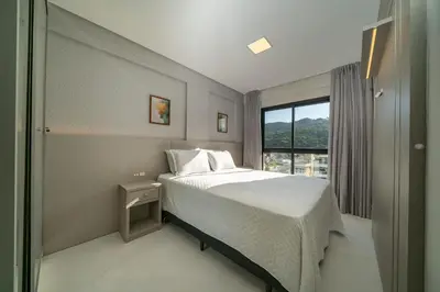Uma cama ou camas num quarto em Aluguel Apto c/ Piscina no Terraço - Bombinhas
