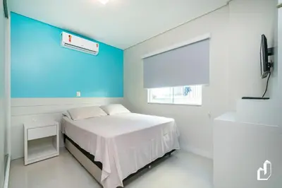 Uma cama ou camas num quarto em Cobertura 03 dormitórios na Avenida dos Coqueiros