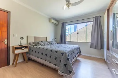 Uma cama ou camas num quarto em Casa Beija-Flor, Piscina exclusiva, Praia de Bombas, Bombinhas