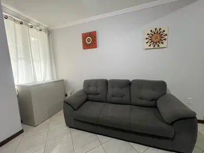 Uma área de estar em Apartamento simple e completo a 100mt da praia de Bombas