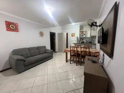 Uma área de estar em Apartamento simple e completo a 100mt da praia de Bombas